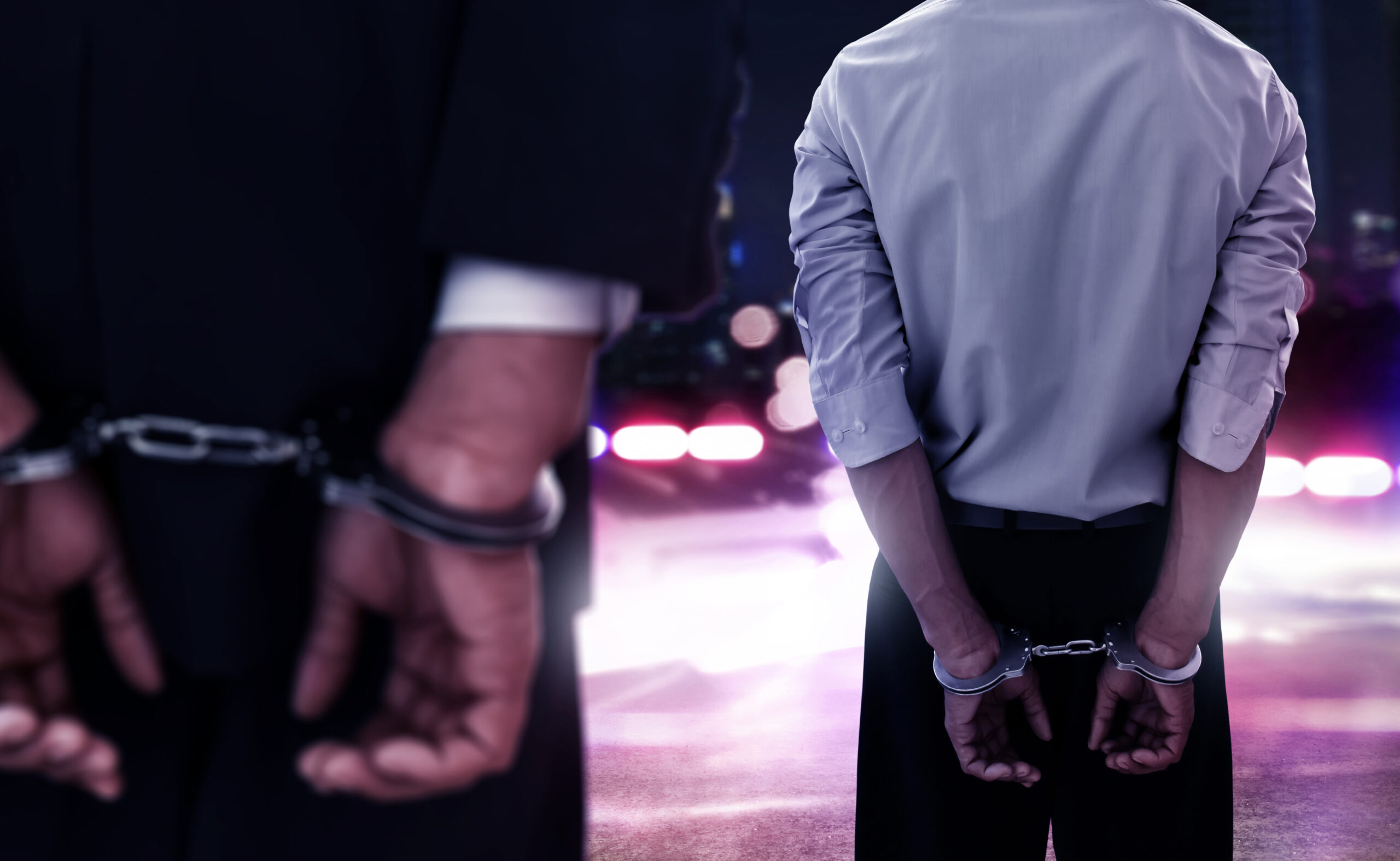 Two,Businessman,In,Handcuffs
