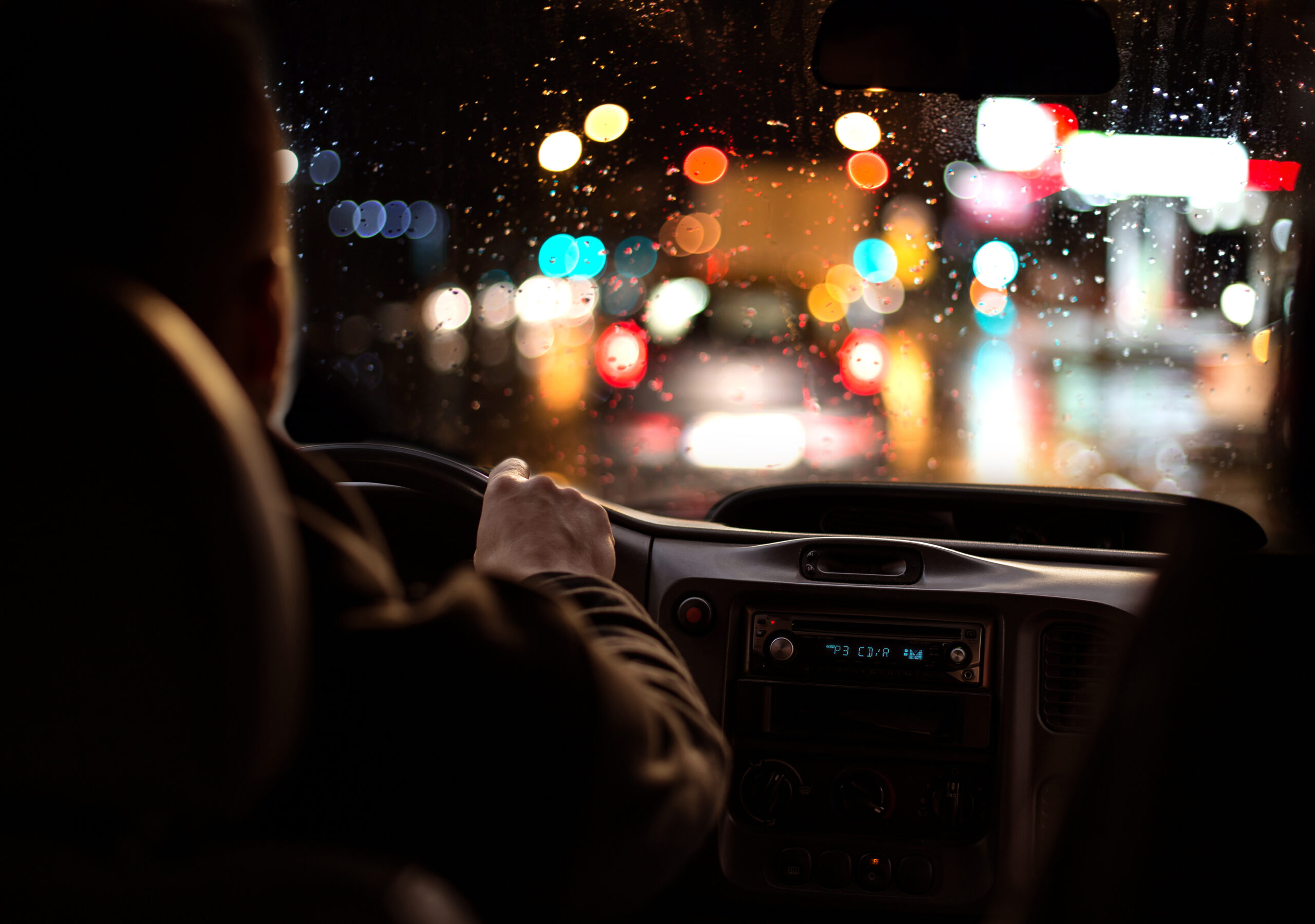 Driving,In,Night,Scenery,,Hands,On,Steering,Wheel.